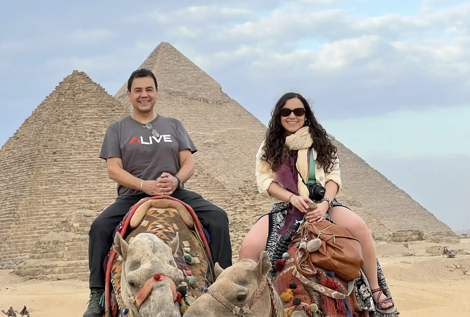 camel ride giza pyramids egypt tourists
