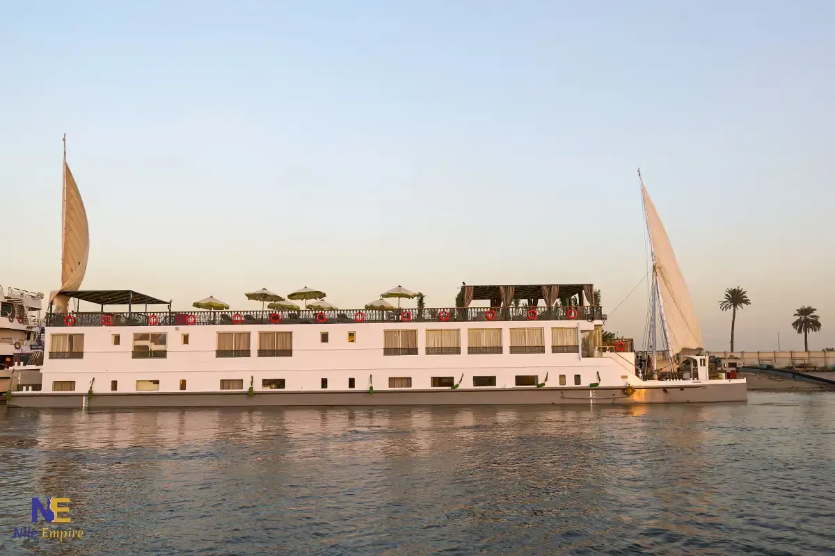 The Nile Majestic dahabiya moored on the Nile at dusk